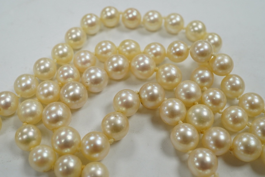 A single strand cultured pearl necklace, with diamond chip set white metal clasp, 88cm. Condition - fair to good